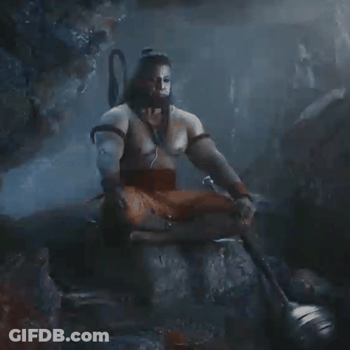 Man Without Shirt Sitting On Rock With Sword GIF