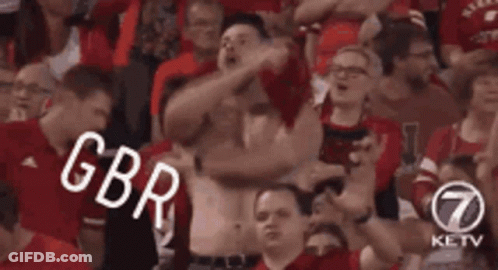 Man Without Shirt Standing In Crowd GIF