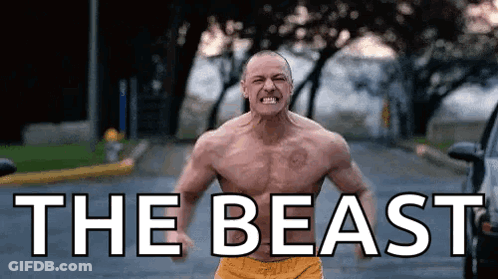 Man Without Shirt Standing On Street GIF