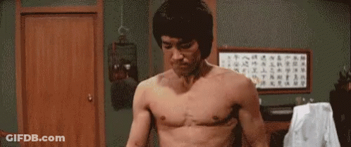 Man Without Shirt Standing With Arms Out GIF