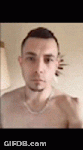 Man Without Shirt Taking Selfie With Necklace GIF