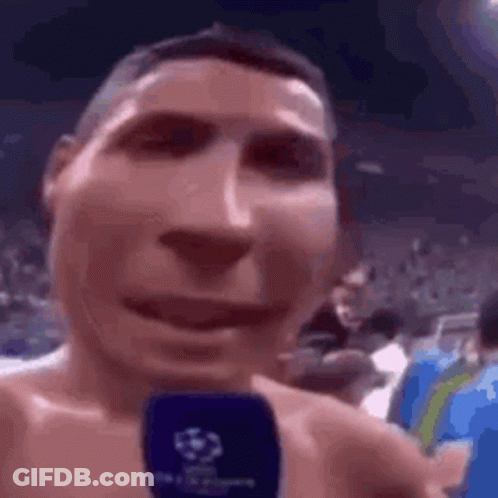 Man Without Shirt Talking Into Microphone GIF
