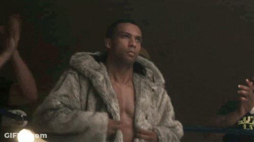 Man Without Shirt Wearing Fur Coat GIF