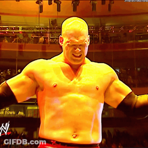 Man Without Shirt With N On Chest In Front Of Crowd GIF