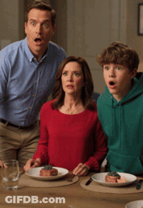 Man Woman And Boy Sitting At Table With Food Saying AI Slop GIF