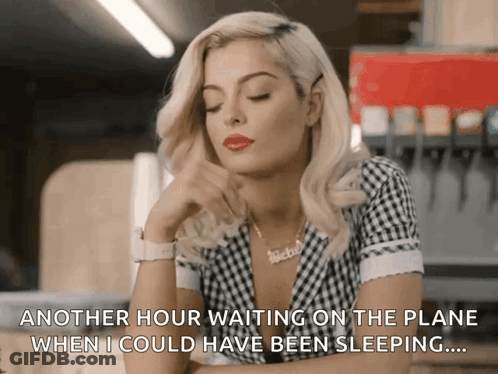 Man Woman Surrounded By Flowers With Foreign Writing GIF