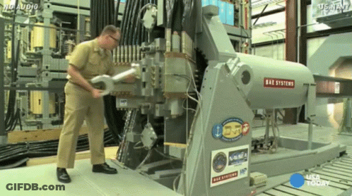 Man Working On Oak Systems Machine GIF