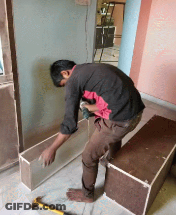 Man Working On Wood With Drill GIF