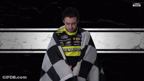 Man Wrapped In Checkered Flag In Ford Racing Uniform GIF