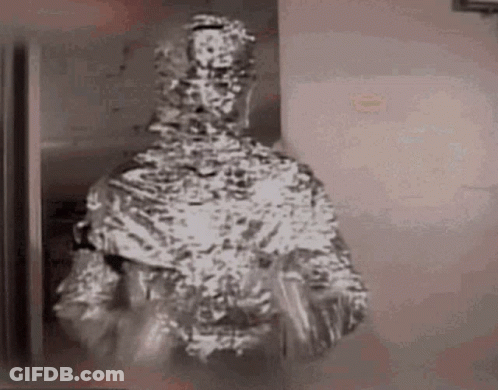 Man Wrapped In Tin Foil Holding Plate GIF