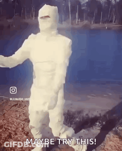 Man Wrapped In Toilet Paper Dancing In Front Of Lake GIF