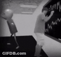 Man Writing On Blackboard With Robot GIF
