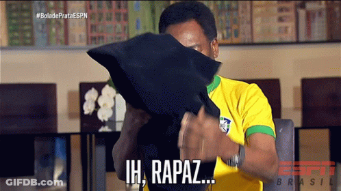 Man Yellow Shirt Covers Face With Black Pillow Saying Ih, Rapaz GIF