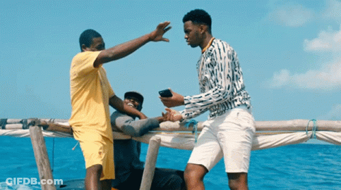 Man Yellow Shirt High Fives Man White Shorts GIF