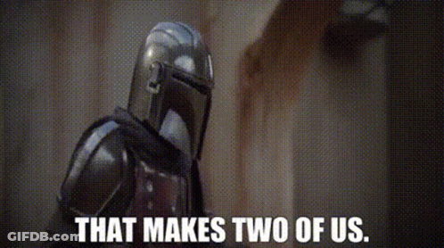Mandalorian Holding Gun Saying That Makes Two Of Us GIF