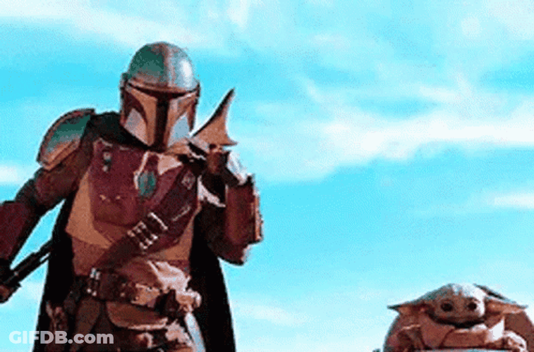 Mandalorian Sitting With Baby Yoda GIF
