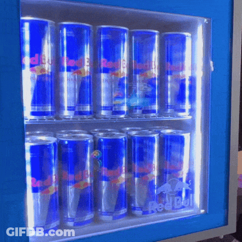 Many Cans Of Red Bull Are Lined Up In A Cooler GIF