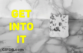 Marble Surface Saying Get Into It In Yellow GIF
