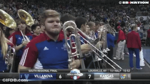 Marching Band Playing In Front Of Kansas Scoreboard GIF