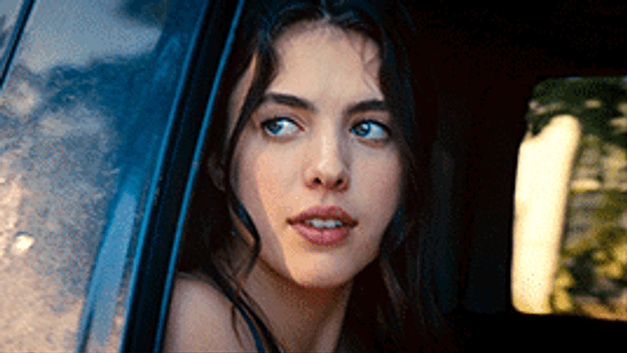 Margaret Qualley Looking Out Car Window GIF