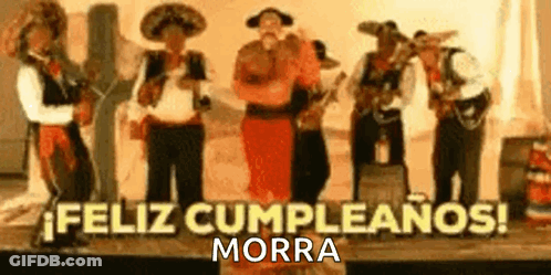 Mariachi Singers Playing Instruments On Stage GIF