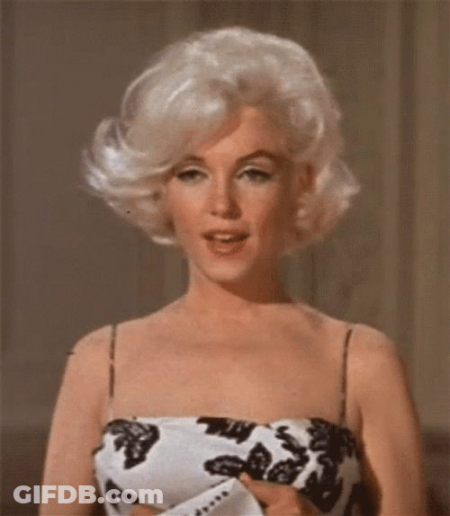 Marilyn Monroe Mouth Blowing Her Hair GIF