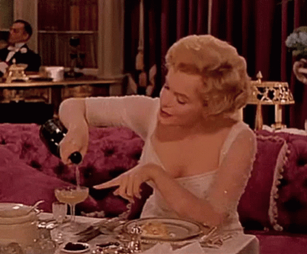Marilyn Monroe Pouring Champagne GIF