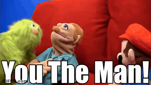 Mario And A Green Puppet Are Sitting On A Red Couch With The Words " You The Man " Below Them GIF