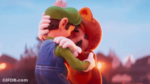 Mario And Luigi Are Hugging Each Other In A Cartoon . GIF