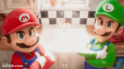 Mario And Luigi Toys Standing In Kitchen GIF