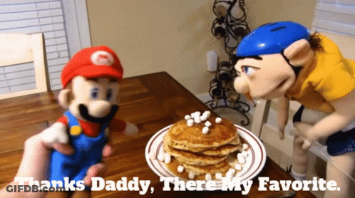 Mario And Slinky Puppet Next To Pancakes With Marshmallows GIF