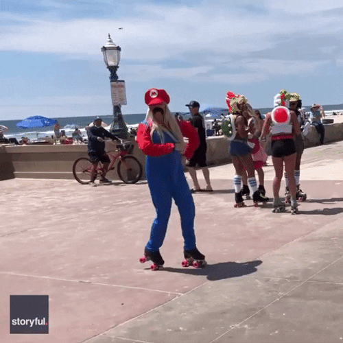 Mario Cosplayer Dancing In Roller Blades GIF