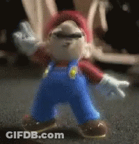 Mario Figure Standing On Table GIF
