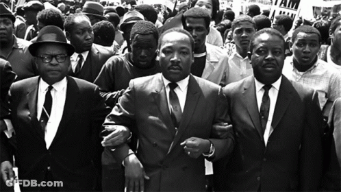 Martin Luther King Jr. Escorted By Men In Suits GIF