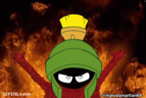 Marvin The Martian Is Standing In Front Of A Fire GIF