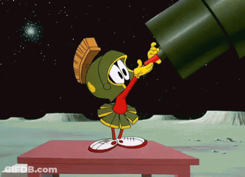 Marvin The Martian Looks Through A Telescope On A Table GIF