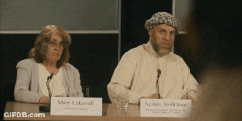 Mary Lakewell And Azzam Al-Britant Are Sitting At A Table GIF