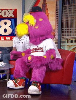 Mascot For The Indians Sitting On Red Chair GIF