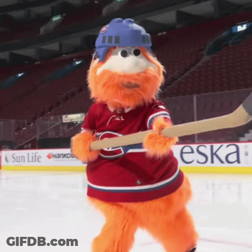 Mascot Holding Hockey Stick In Front Of Sun Life Ad GIF