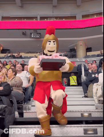 Mascot Holding Popcorn In Front Of Crowd GIF