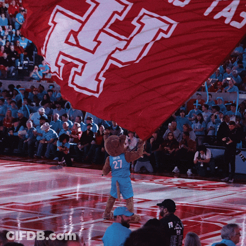 Mascot Holding Red Flag With Letter H GIF