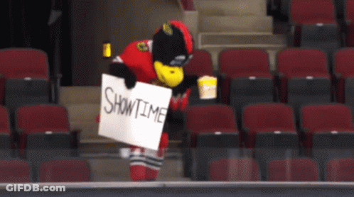 Mascot Holding Showtime Sign GIF