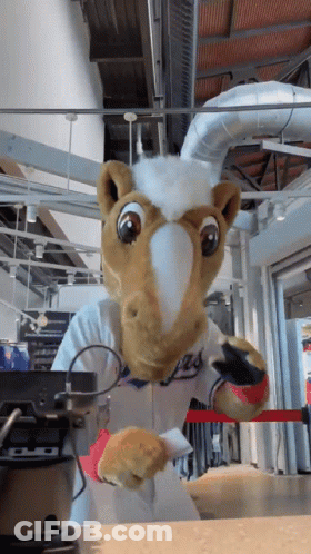 Mascot In Chef Outfit Standing In Front Of Blender GIF