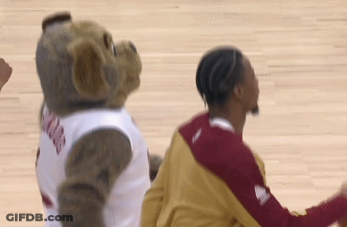 Mascot In Jersey Next To Basketball Player GIF
