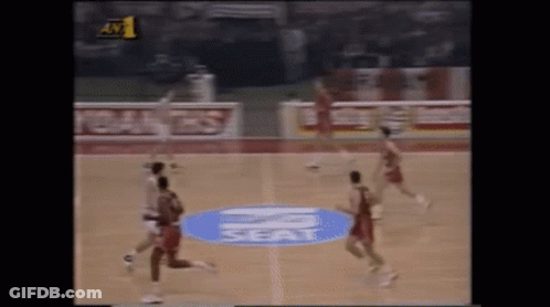 Mascot In Number 0 Jersey Standing In Front Of Crowd GIF