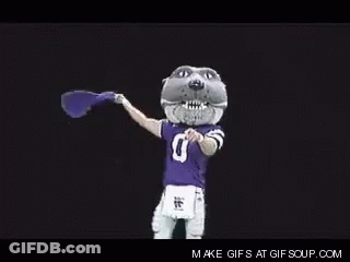Mascot In Purple Jersey Holding Purple Flag GIF