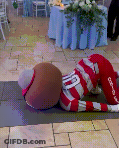 Mascot In Red And White Striped Outfit With Number 10 GIF