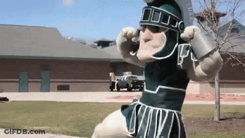 Mascot In Spartan Helmet And Green White Outfit GIF