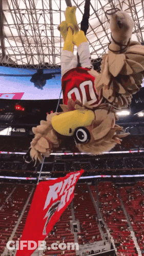 Mascot In Stadium With Pizza Hut Banner GIF