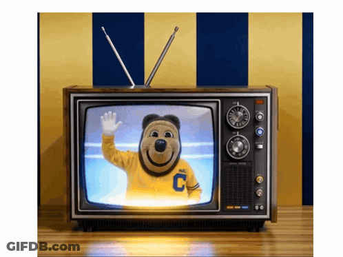 Mascot In Yellow Shirt With Letter C On TV GIF